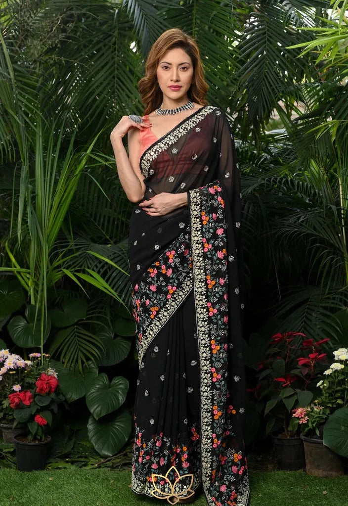 A silk georgette cherry printed sari with a black embroidered