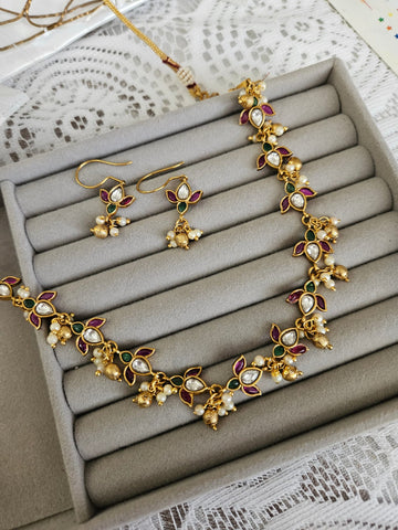 Aarvi goldplated contemporary Necklace set with Red and Green Stonework