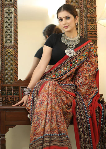 COTTON KALAMKARI PRINT SAREE WITH MIRRORWORK AND AJRAKH BORDER.