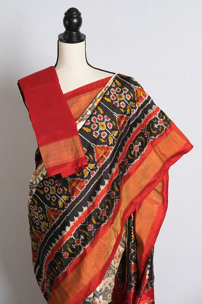 Skirt Border Patola Ikkat Silk Saree in Off White, Red, and Black