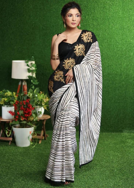 WHITE STRIPED SAREE WITH GOLD EMBROIDERED BORDER ON PALLU